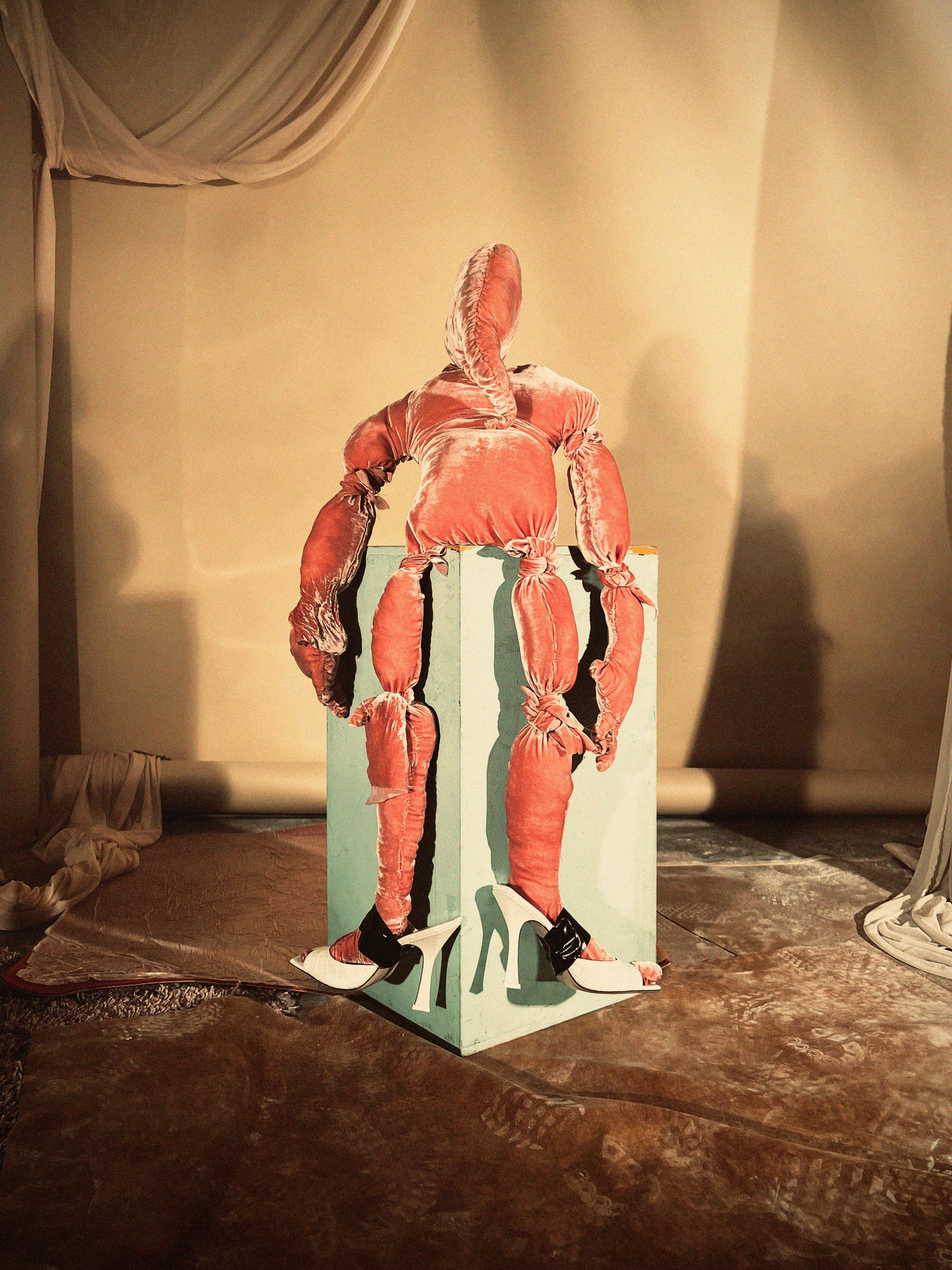 Shoes by The Attico. Sculpture: ,Velvet Knight,, Julian Farade, 2022.
