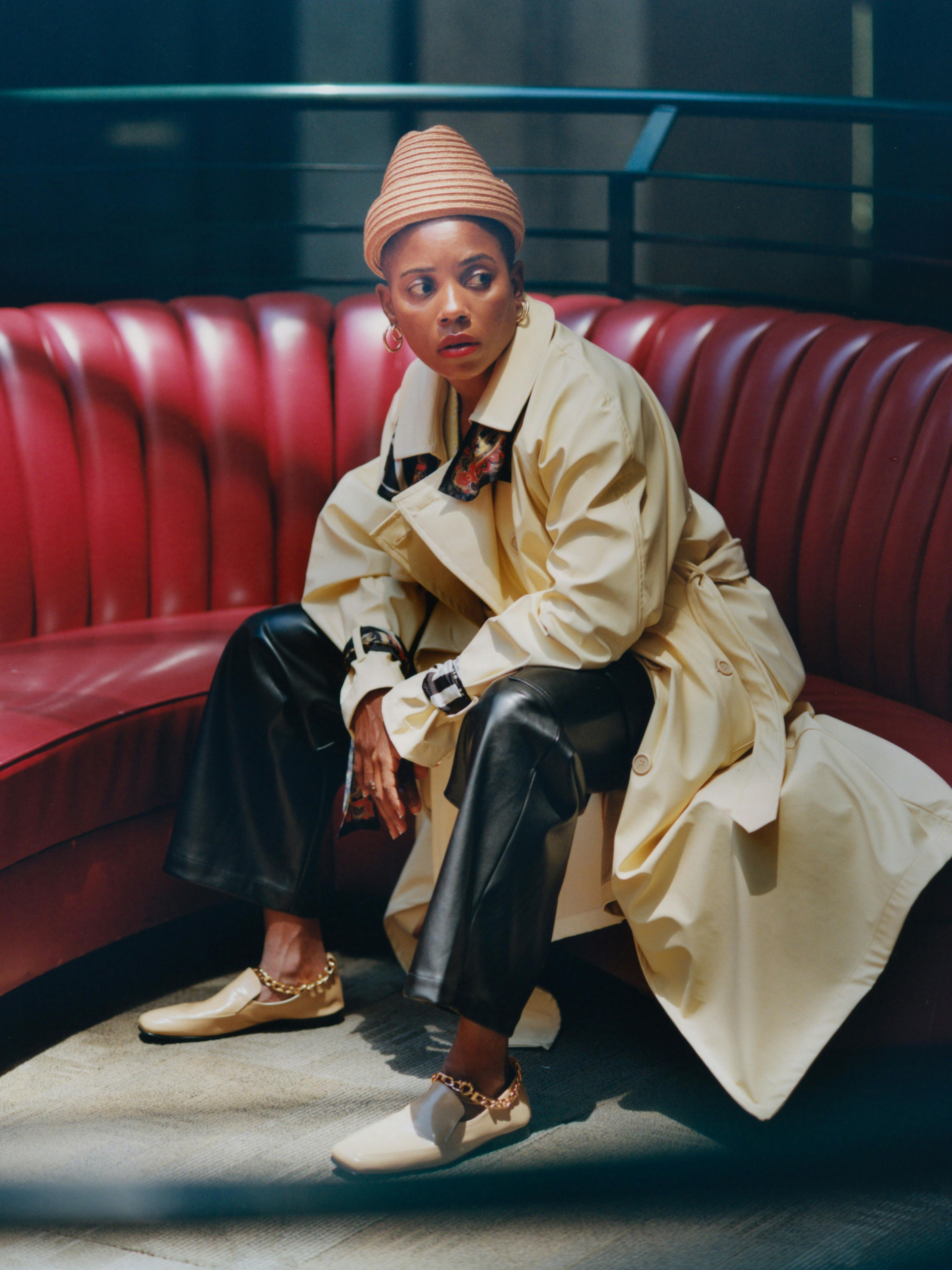 Trenchcoat by Ottolinger. Vest by The Elder Statesman. Pants by Nomia. Hat by ESENSHEL. Shoes by BY FAR. Earrings, Bravo's own. Ring by E.M. Kelly.