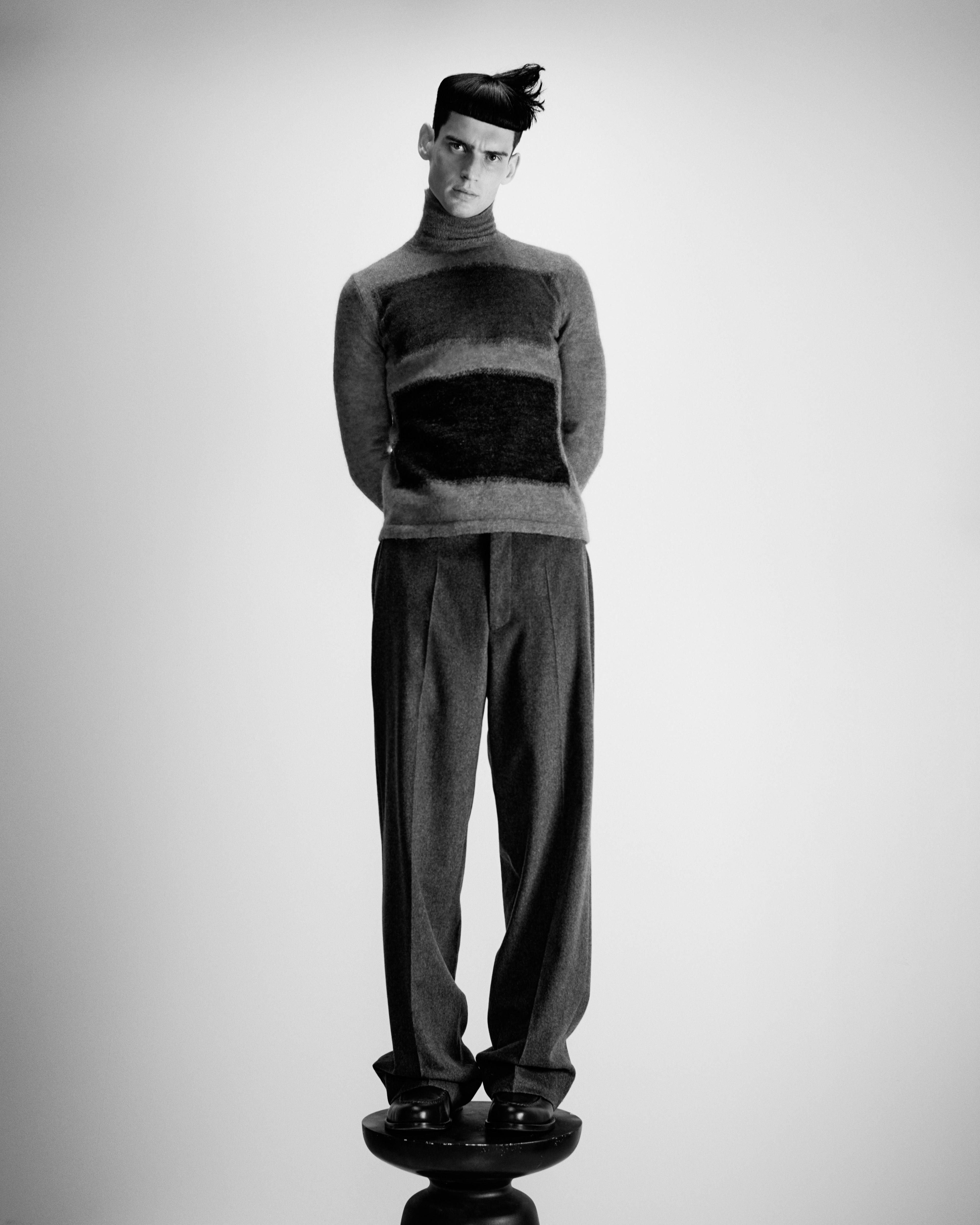 Vintage sweater by Raf Simons from Artifact. Pants and shoes by Officine Générale.