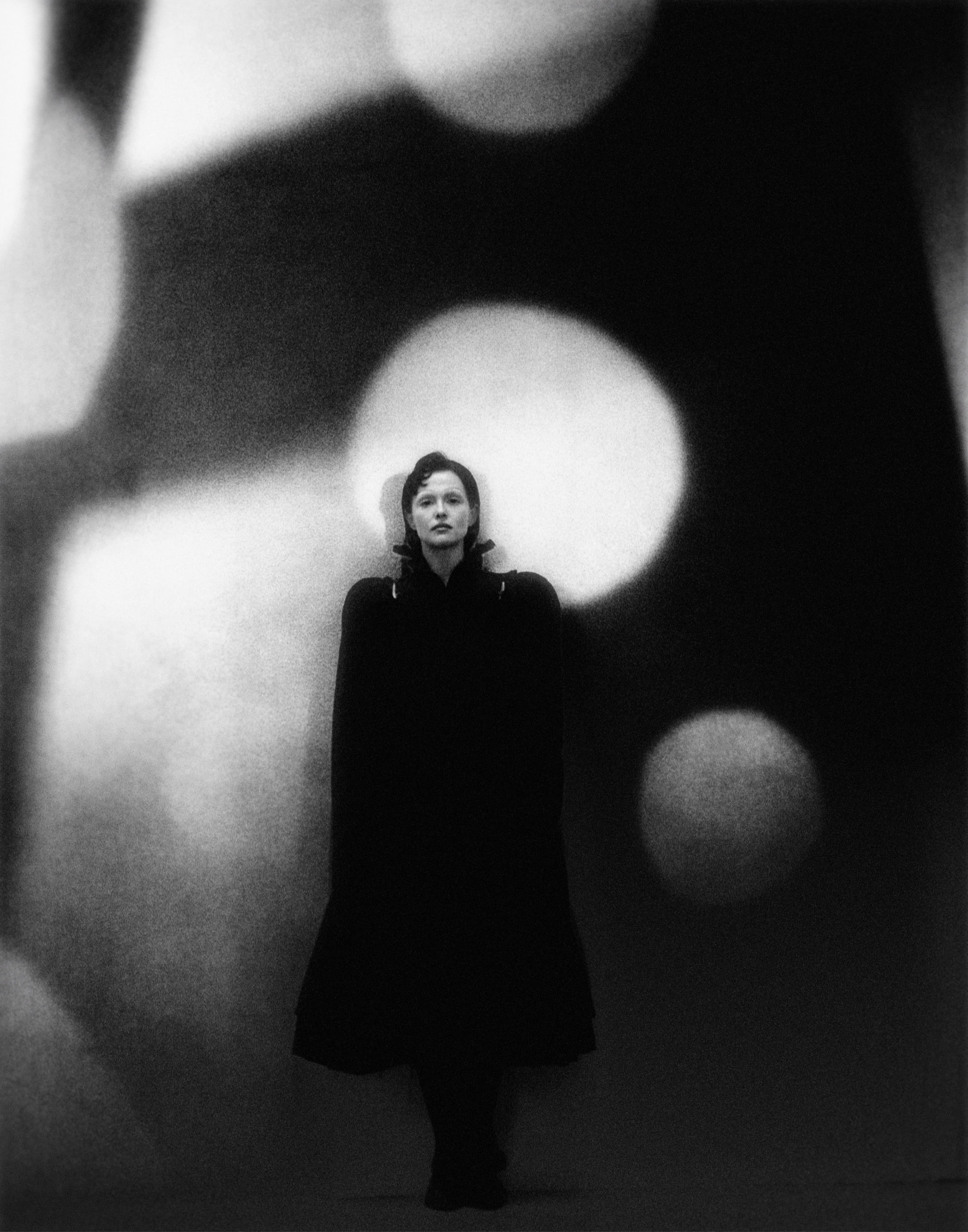 COAT by ,Meruert Tolegen. ,TIGHTS, stylist’s own. SHOES by ,Miu Miu.
