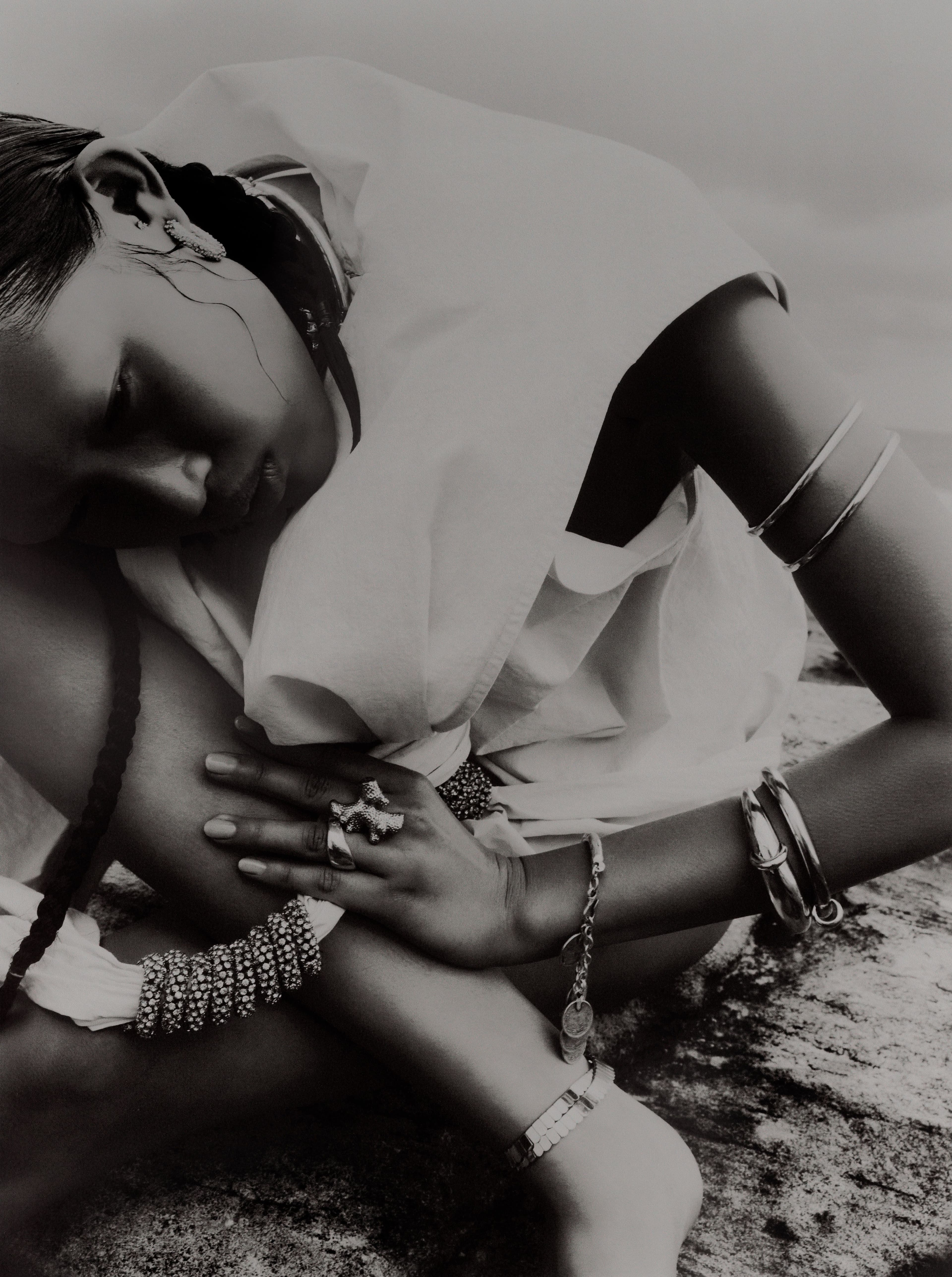 Top, earrings, arm cuff, and bracelets second from top by Christopher Esber. Vintage necklace, bracelet, and necklace, worn as anklet, from Uuli’s Unique & Unusual. All rings by Dinosaur Designs.