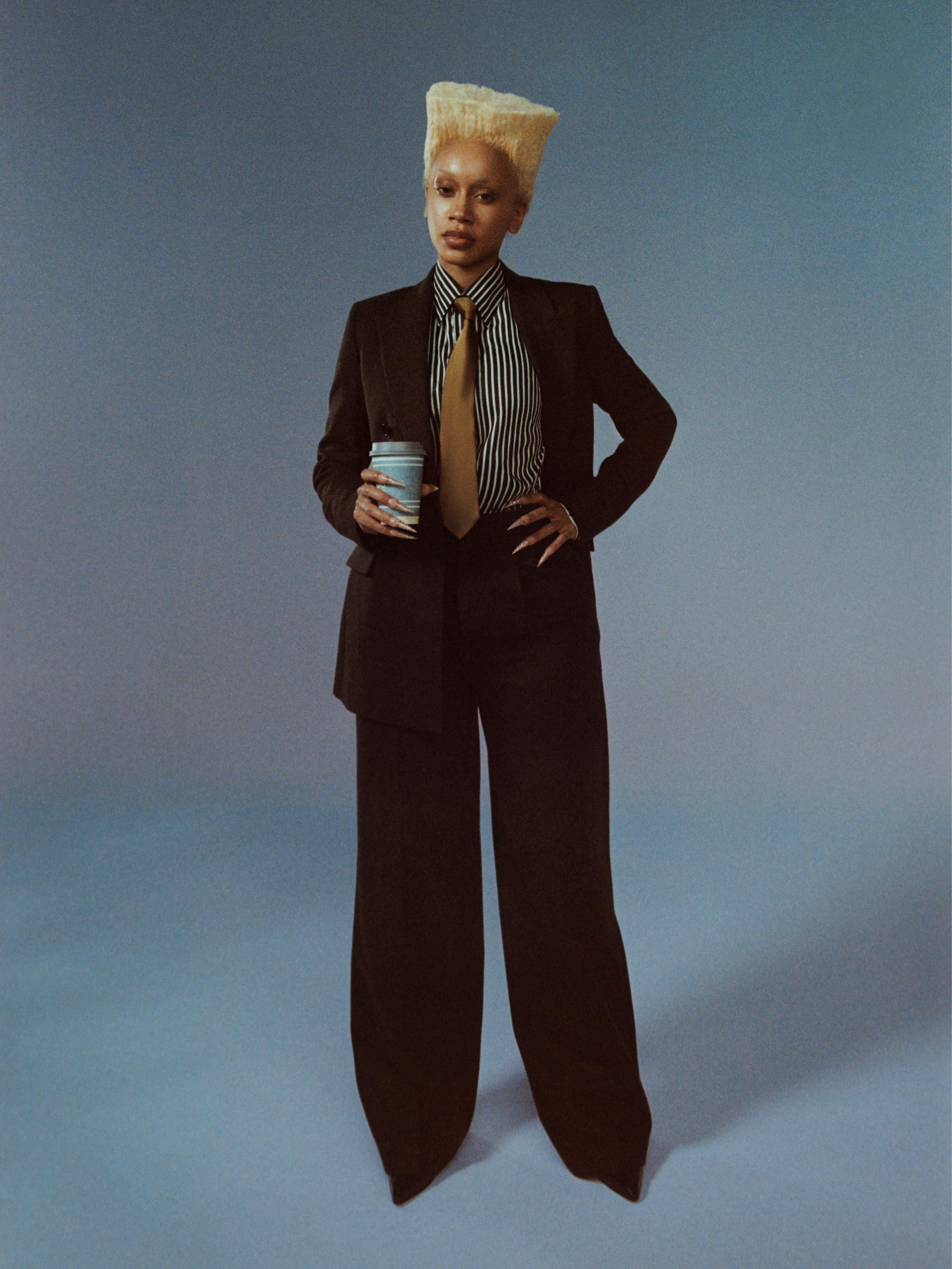 JACKET, PANTS, and SHOES by ,AMI Paris. ,SHIRT and TIE, stylist’s own.