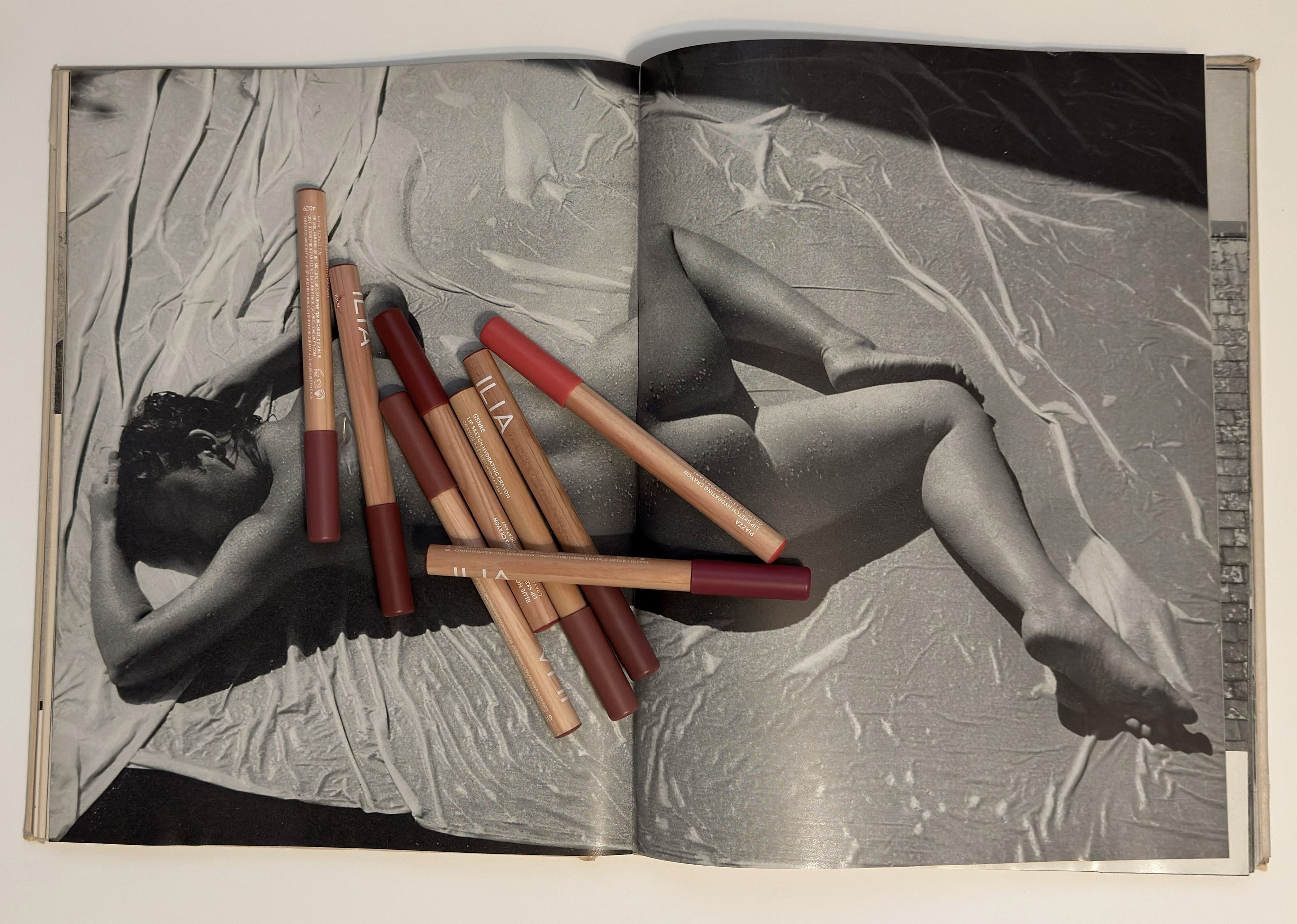 A selection of products from Bottega Veneta, Augustinus Bader, Byredo, and Hermès as styled and shot in still life by Silvia Prada.