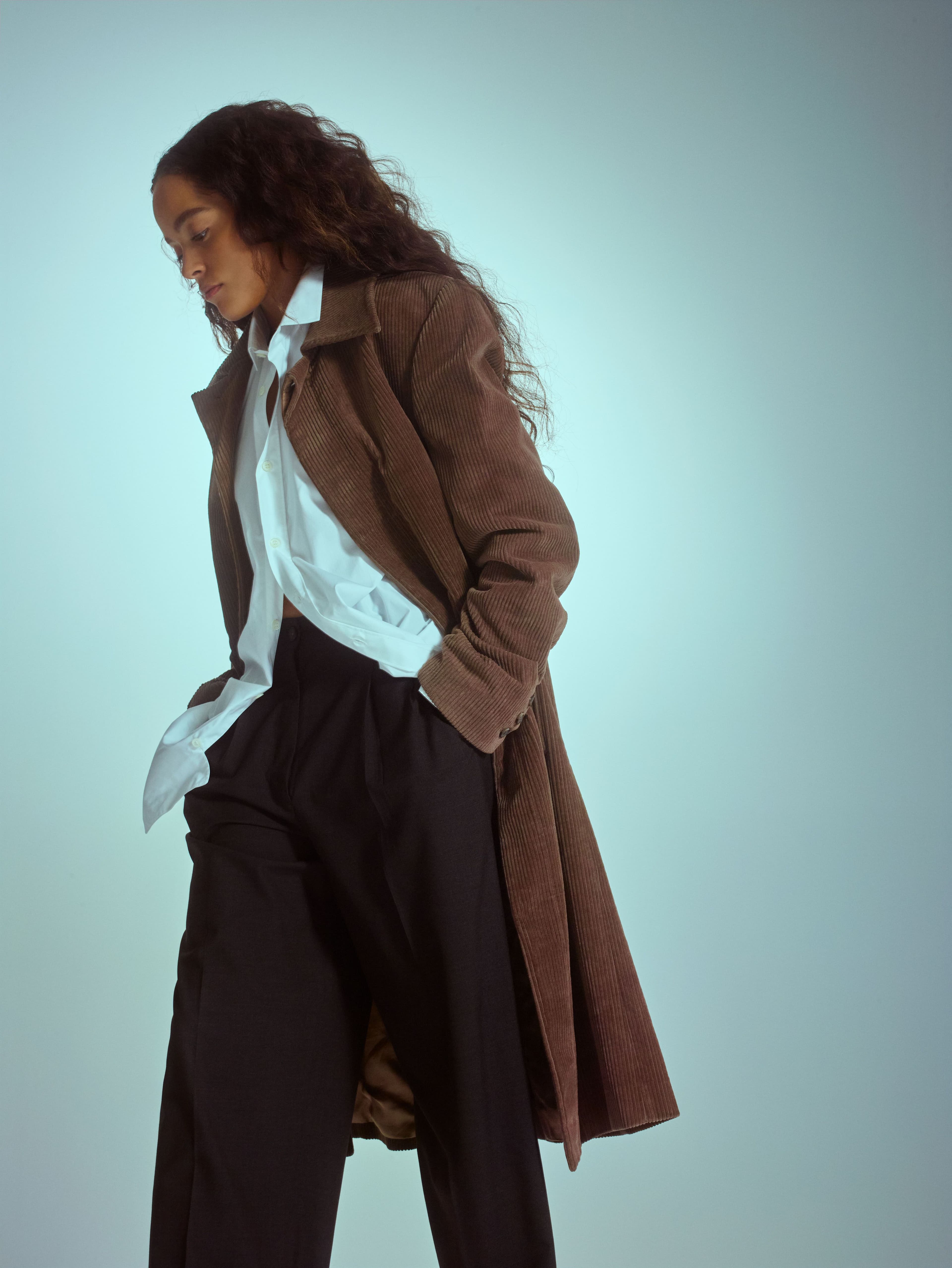 Vintage coat by Raf Simons. Vintage shirt by Saint Laurent. Vintage pants by Hermès.