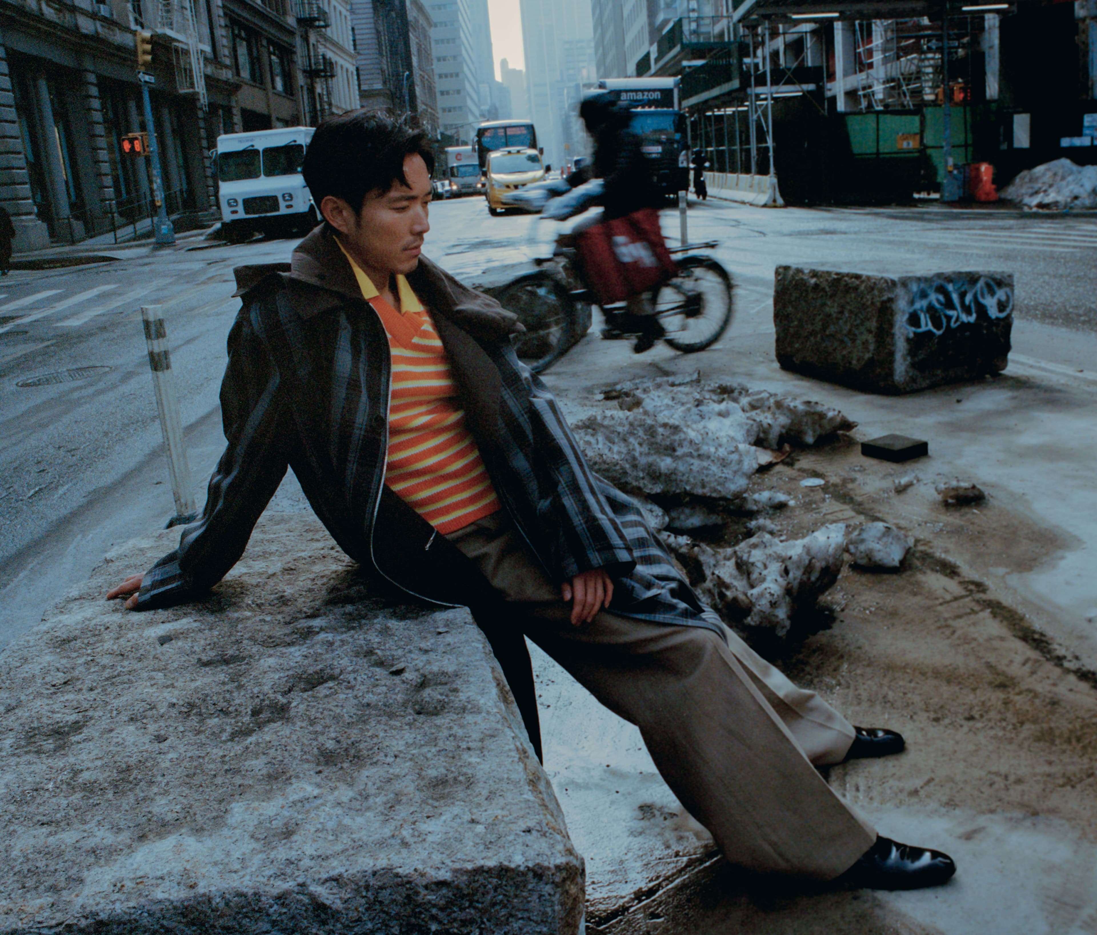 COAT by Hermès; SWEATER by KYLE’LYK; PANTS by Louis Vuitton; SHOES by Saint Laurent