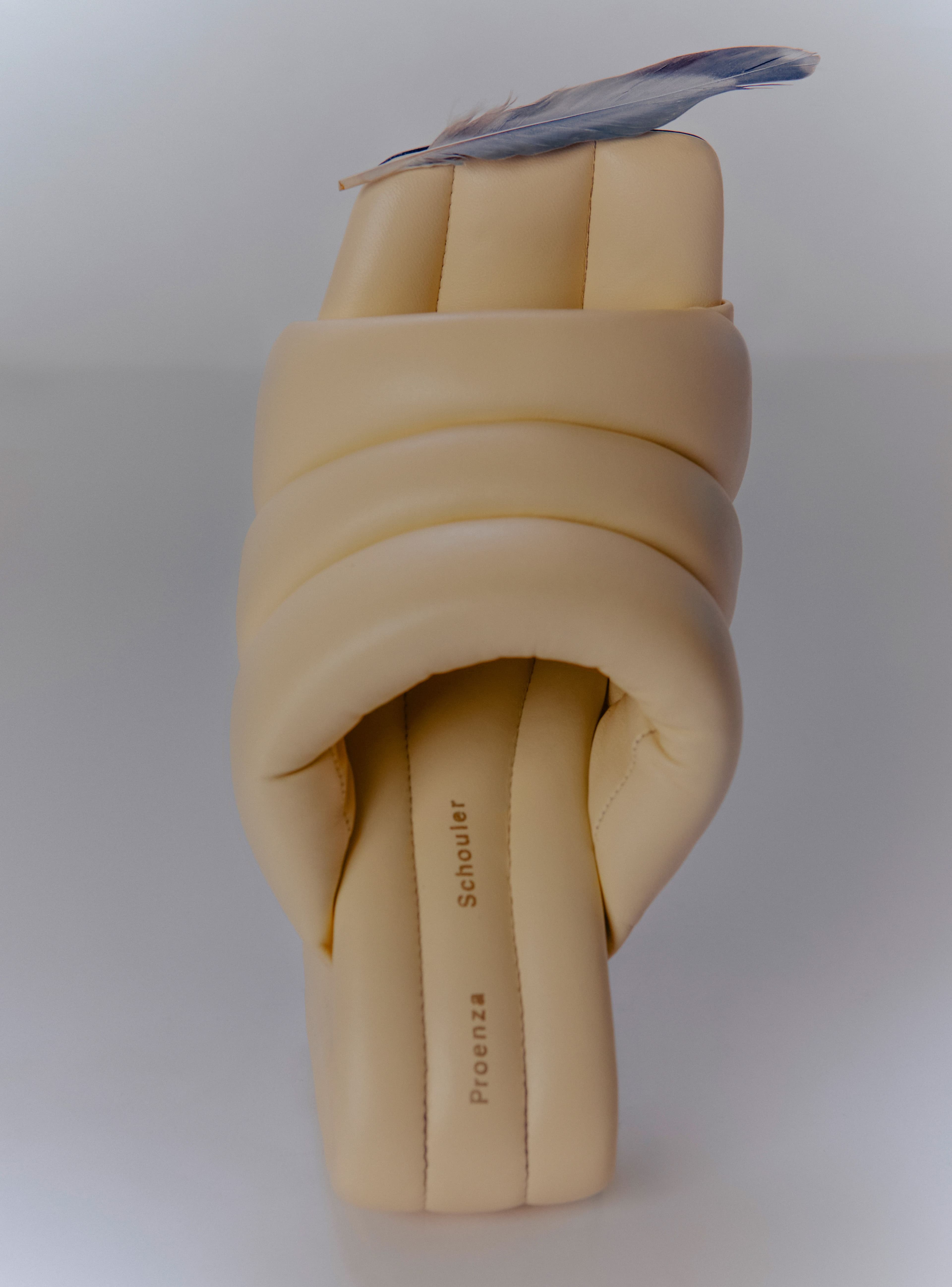 Founded at the turn of the century by Parsons alumni Jack McCollough and Lazaro Hernandez, Proenza Schouler continues to garner acclaim through its modern designs rooted in timeless geometries. These height-boosting nappa sandals integrate puffed-up padding to create a seamless silhouette from insole to waterfall heel, resulting in a bulkier silhouette which calls to mind groovy Seventies furniture.