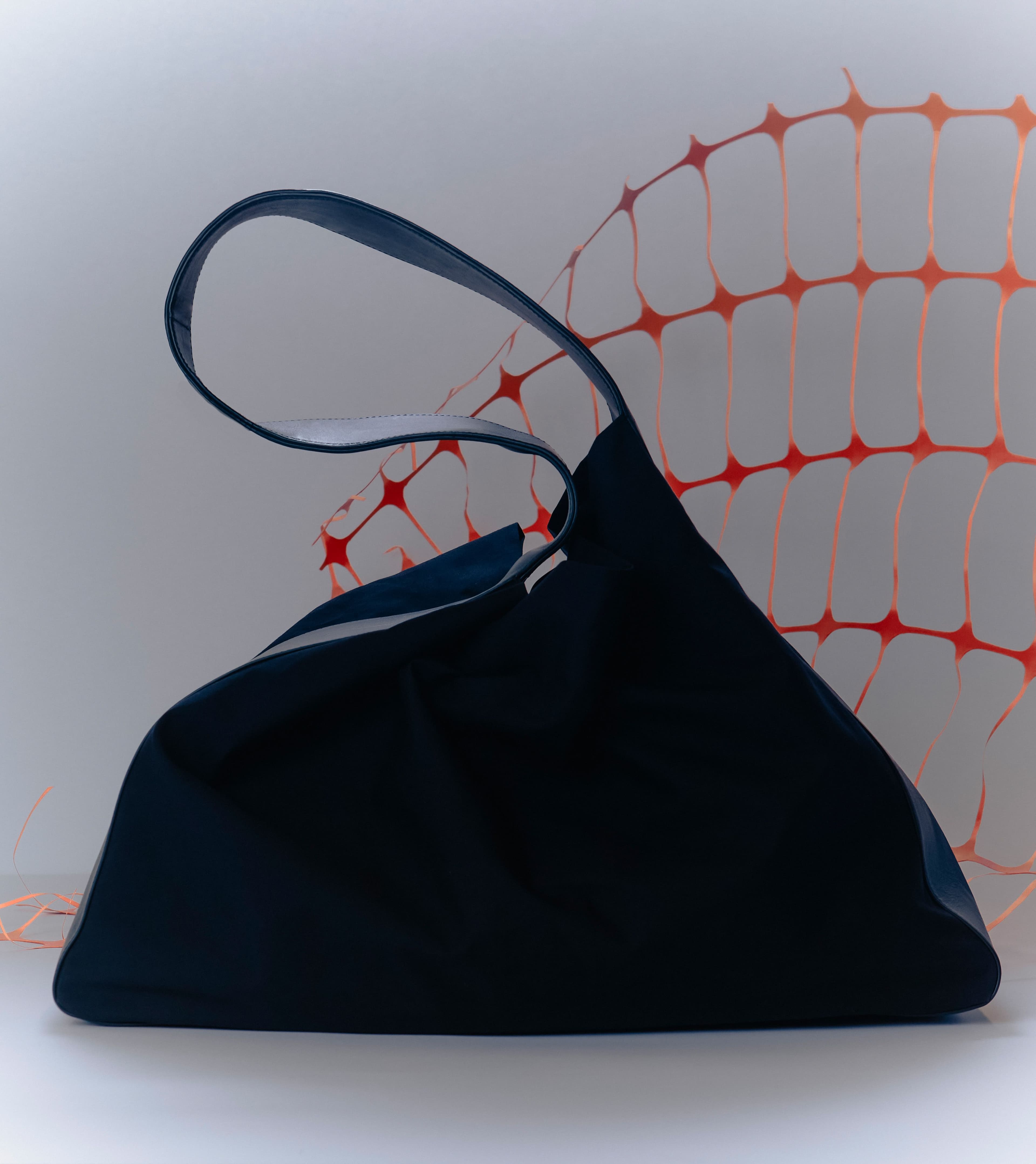 Constructing functional and technically brilliant designs using carefully sourced materials at his top-floor studio in Industry City, Peter Do aims to create pieces which complement the complex lives of his customers. His soft tote, an evolution of his signature Dumpling bag, consists of a structured lambskin exterior and a pliable cotton body, striking a balance between elegant form and everyday functionality.