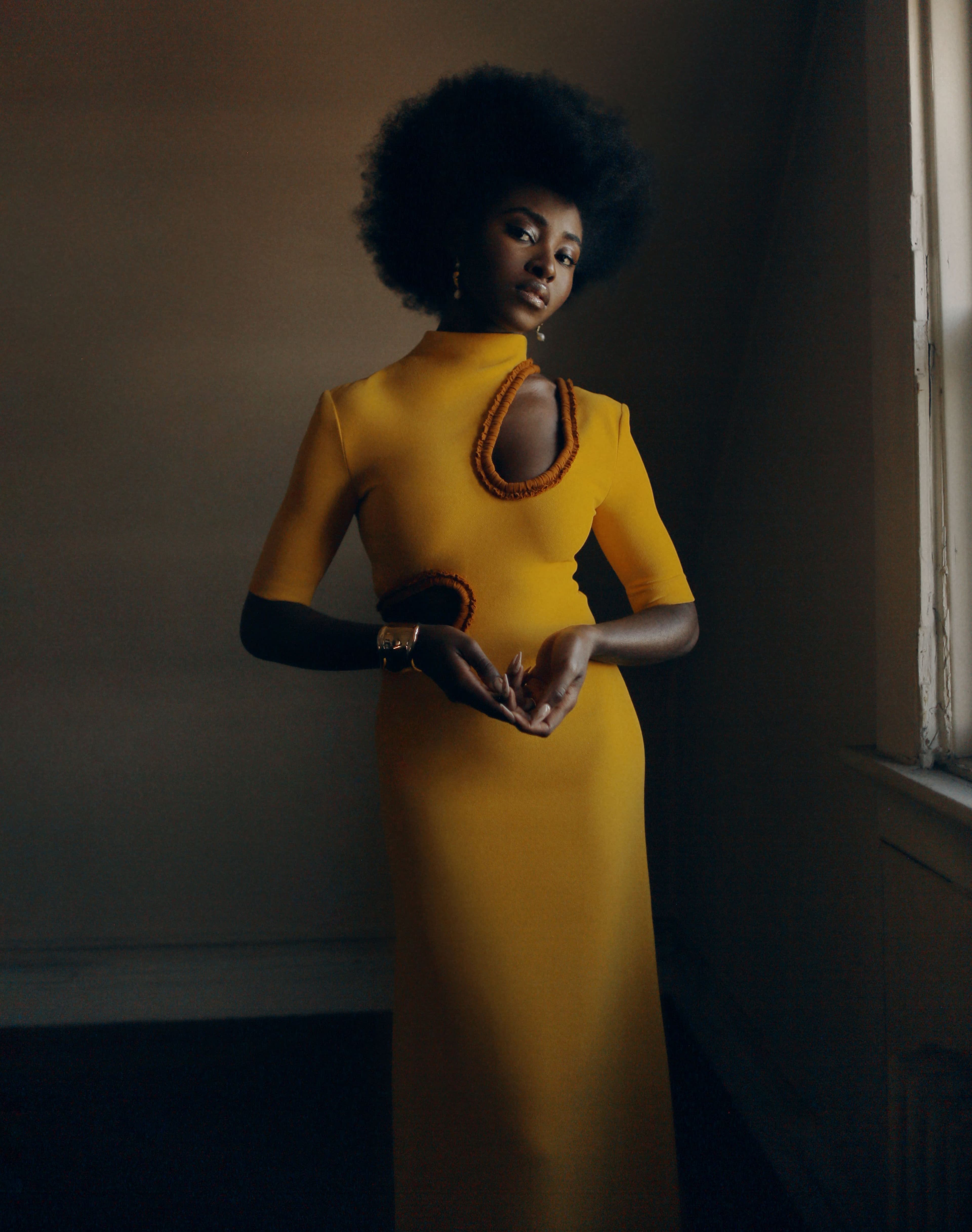 Dress by Proenza Schouler. Earrings by Dorsey. Bracelet by Tiffany & Co.